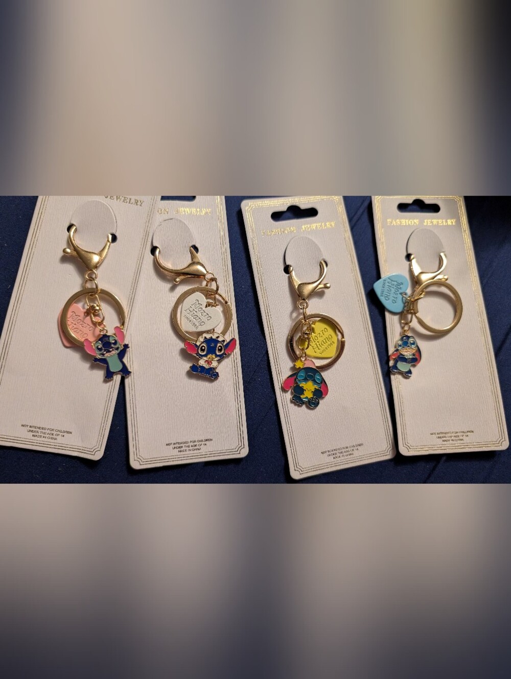 4 New Gold Keychain with Blue and Pink Stitch Character